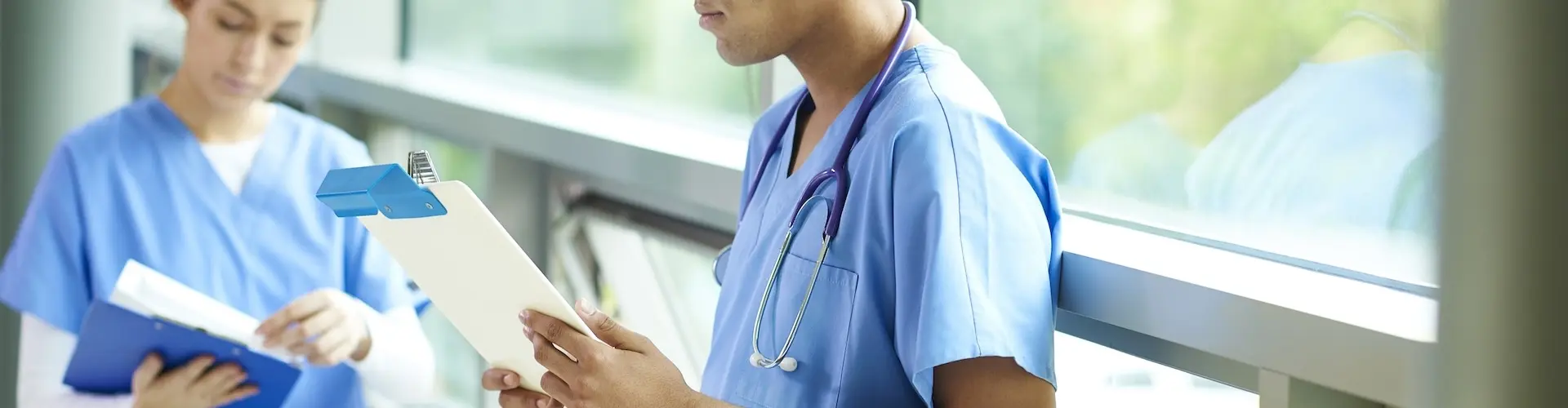 Two nurses in a hospital corridor