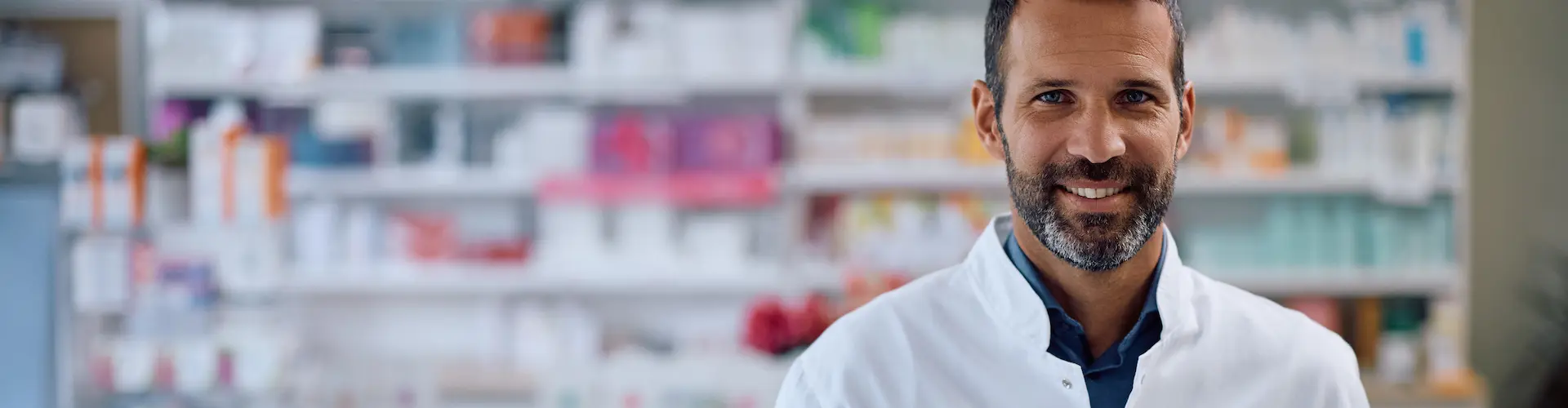 Pharmacist standing at a counter