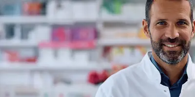 Pharmacist standing at a counter