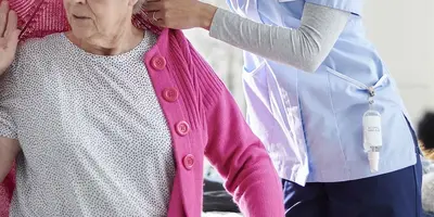 Healthcare Assistant helping a patient