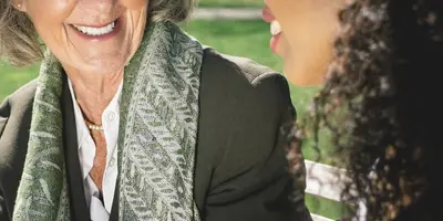 Care Assistant talking with care home resident