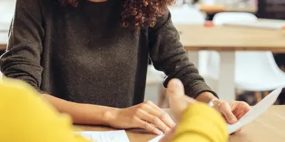 Two people talking in a meeting