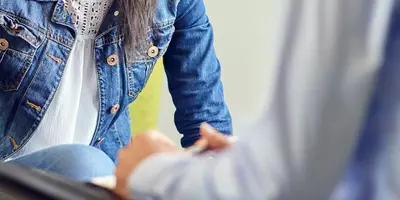 Two people talking in a meeting