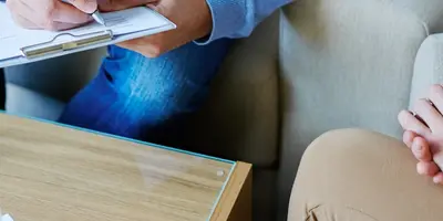 Psychologist talking to a patient